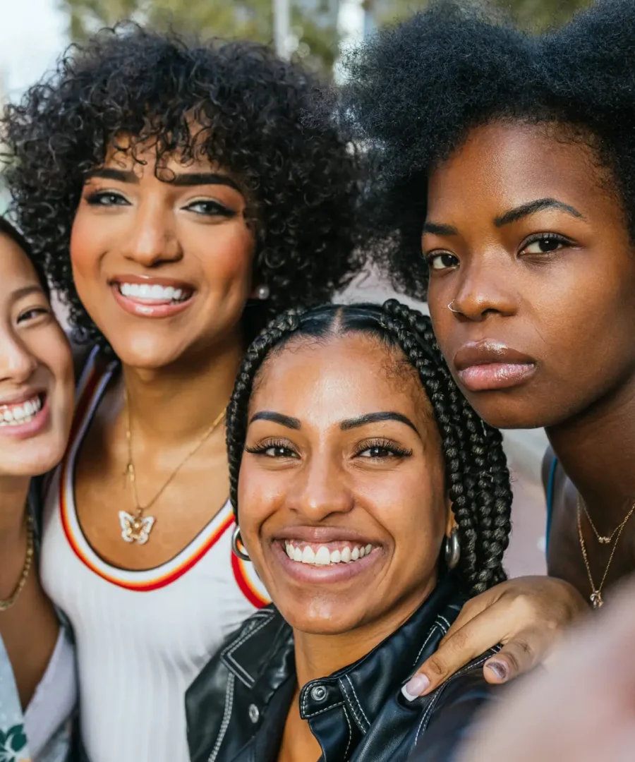 diverse-group-of-female-friends-sharing-a-joyful-m-2024-04-17-00-06-03-utc-scaled